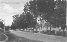 SA1662 - A view of a road through the Sabbathday Lake, Me. Village. Identified on the front.